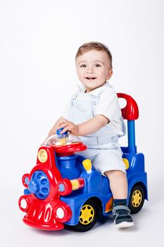 baby boy playing with a toy truck