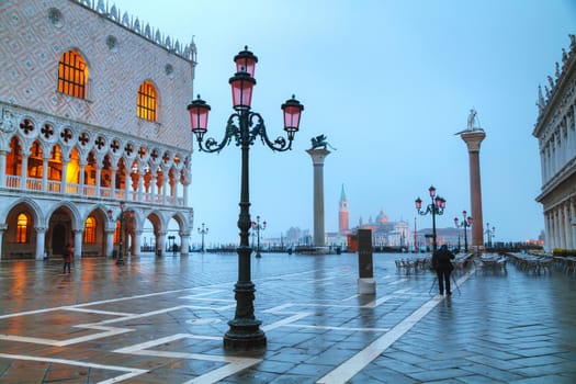 VENICE - NOVEMBER 20: San Marco square with tourists on November 20, 2015 in Venice, Italy. It's the principal public square of Venice, where it is generally known just as the Piazza.