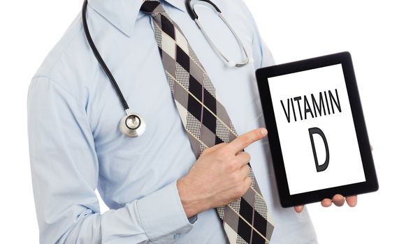 Doctor, isolated on white backgroun,  holding digital tablet - Vitamin D