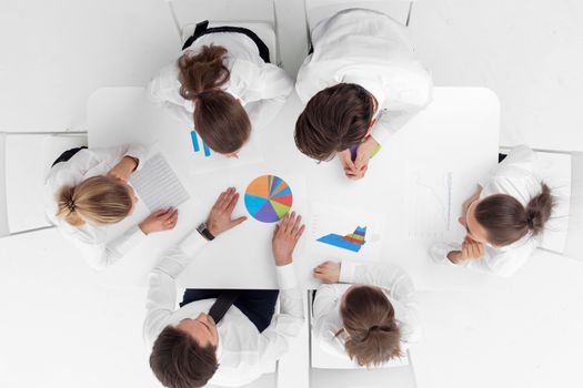 Top view of business people working with financial reports