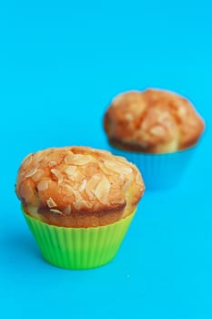 Muffins in silicone tins on a blue background