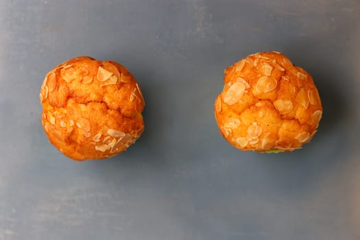 Muffins in silicone tins on a blue background