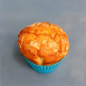 Muffins in silicone tins on a blue background