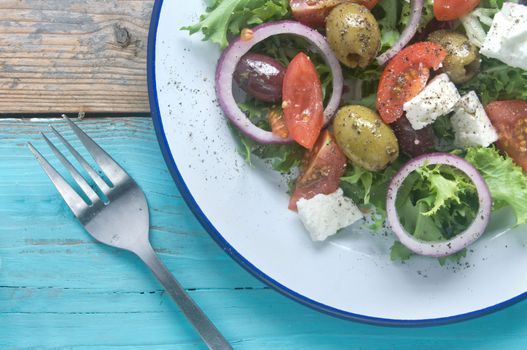 Close up of a traditional greek salad with tomatoes and feta cheese