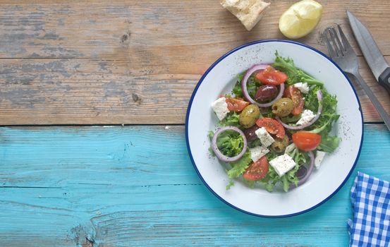 Freshly made greek salad with feta cheese and tomatoes