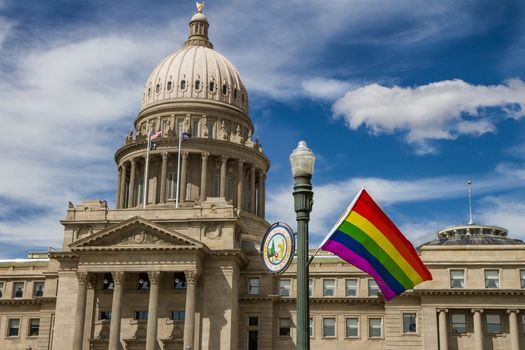 BOISE, IDAHO/USA - JUNE 20, 2016: Boise capital building with a LGBT Pride flag in front of it during pridefest