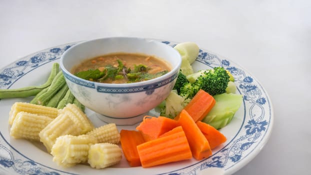 Spicy crab roe chili sauce served with vegetable on dish
