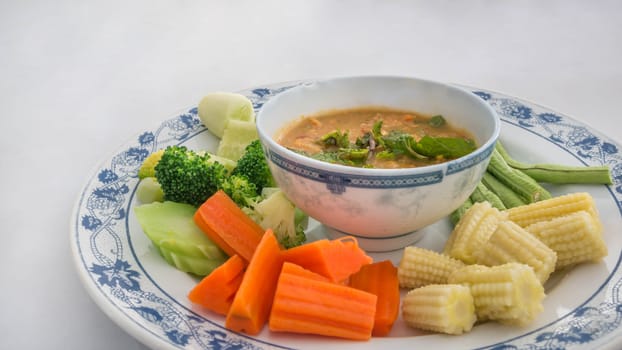 Spicy crab roe chili sauce served with vegetable on dish