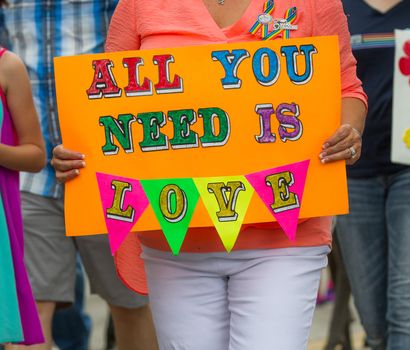 BOISE, IDAHO/USA - JUNE 20, 2016: Sign reading all you need is love during Boise Pridefest