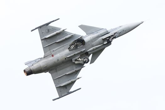 LEEUWARDEN, THE NETHERLANDS-JUNE 10: Modern tactical fighter jet JAS-39 Gripen performs at the Dutch Airshow on June 10, 2016 at Leeuwarden Airfield, The Netherlands.