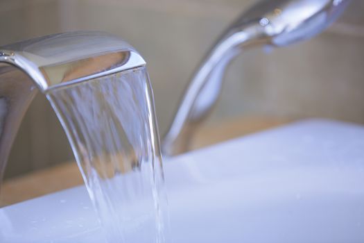 Close-up view of the tap with flowing water