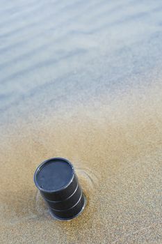 Oil barrel abandoned at the sea coast