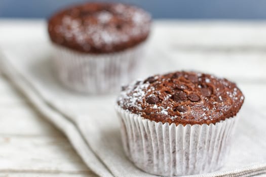 Two chocolate muffin on a fabric napkin