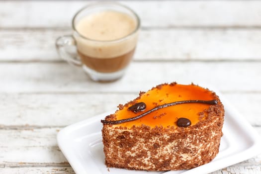 coffee cake and cup of coffee on old wooden table