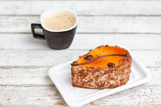 coffee cake and cup of coffee on old wooden table