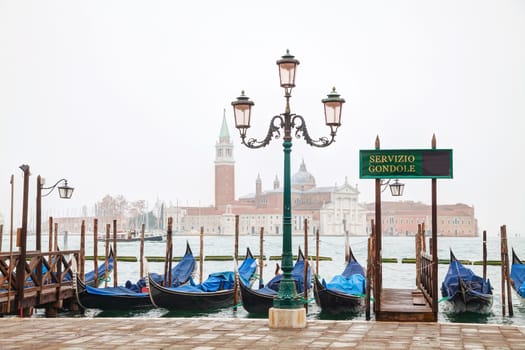 Gondolas floating in the Grand Canal on a cloudy day