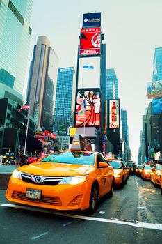 NEW YORK CITY - SEPTEMBER 04: Yellow cab at Times square in the morning on October 4, 2015 in New York City. It's major commercial intersection and neighborhood in Midtown Manhattan at the junction of Broadway and 7th Avenue.