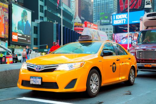 NEW YORK CITY - SEPTEMBER 04: Yellow cab at Times square in the morning on October 4, 2015 in New York City. It's major commercial intersection and neighborhood in Midtown Manhattan at the junction of Broadway and 7th Avenue.