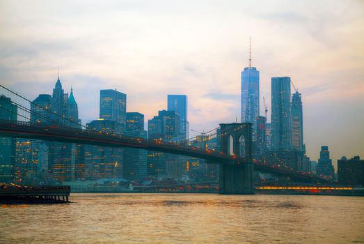 New York City overview with Brooklyn bridge at sunset