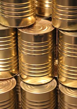 Vertical perspective line of golden metal cans