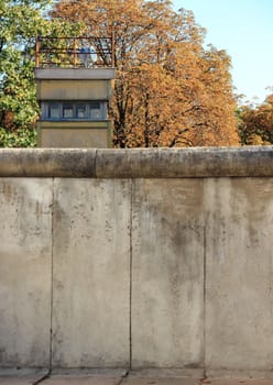 Berlin wall Germany with guard tower in autumn