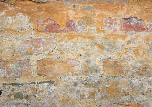 Old weathered yellow brickwall texture and background