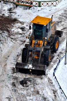 Cleaning of snow from city streets by means of special equipment