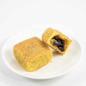 The tasty Taiwanese cranberry pastry cake on the small white dish.