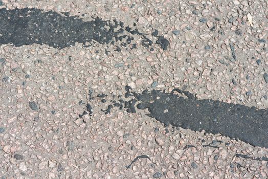 asphalt texture with big black spots.