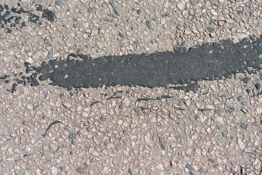 asphalt texture with big black spots.