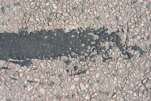 asphalt texture with big black spots.