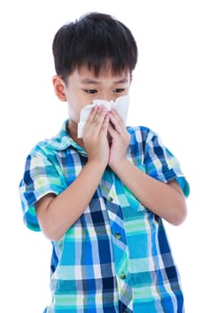 Childhood, healthcare and medicine concept. Handsome asian boy blowing his nose into tissue. Sick child with allergy symptom. Isolated on white background. Studio shot.