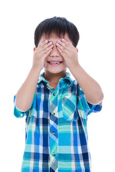 Playful asian boy covering his eye. Isolated on white background. Positive human emotion, facial expression feeling reaction. Studio shot.