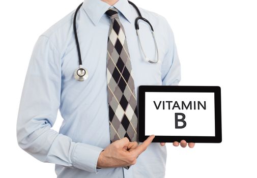 Doctor, isolated on white backgroun,  holding digital tablet - Vitamin B