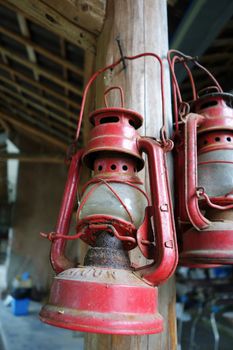 Antique kerosene lamp hanging on old wood