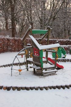 Public Children Playground  in Winter covered with Snow. No Kids around.