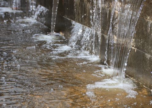 Perspective of Water Pressing through Concrete Wall and into pool