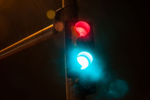 Flaring lights on at the same time during a heavy rainstorm