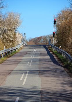 Red Traffic Lights at Dead End Asphalt Road Hill