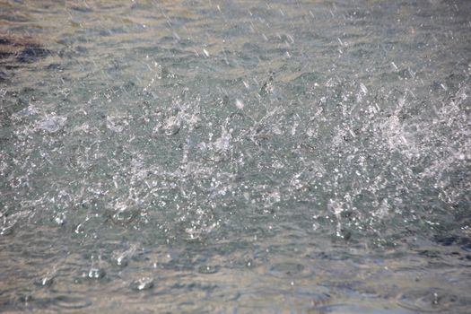 Isolated Rainfall on Perspective Plain Water Surface