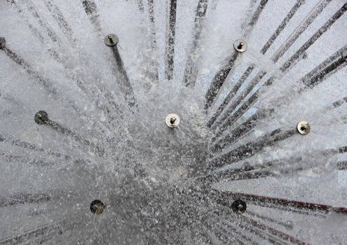 Abstract Round Water Splash from Circular Steel Tube Fountain