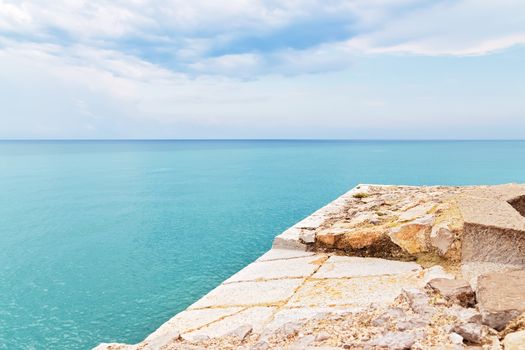 Waterfront and turquoise sea of Peniscola, resort in the province of Castellon, Valencian Community, Spain.