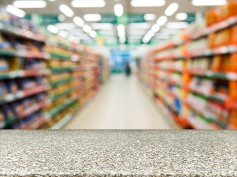 Marble board empty table in front of blurred background. Perspective marble over blur in supermarket - can be used for display or montage your products. Mock up for display of product.