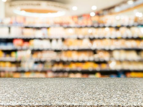 Marble board empty table in front of blurred background. Perspective marble over blur in supermarket - can be used for display or montage your products. Mock up for display of product.