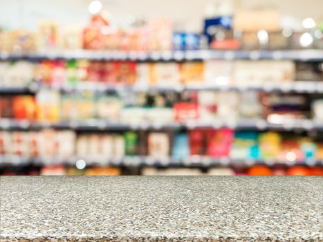 Marble board empty table in front of blurred background. Perspective marble over blur in supermarket - can be used for display or montage your products. Mock up for display of product.