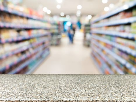 Marble board empty table in front of blurred background. Perspective marble over blur in supermarket - can be used for display or montage your products. Mock up for display of product.