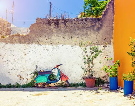 vintage scooter in the colorful  village Koskinou on the island of Rhodes, Greece