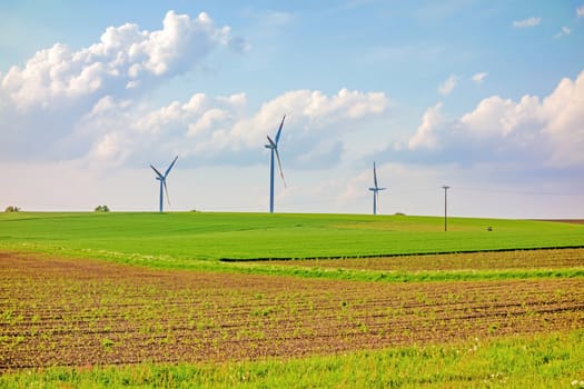 Windmills, eco power, wind turbines on farmland