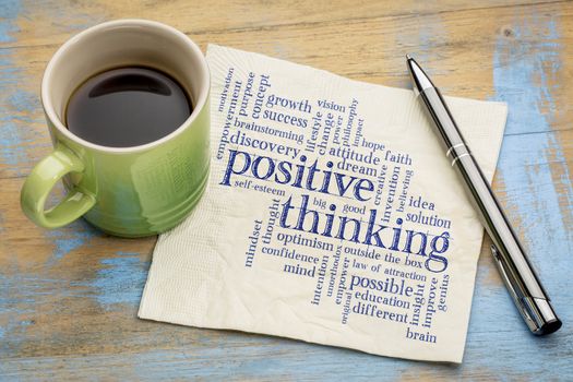 positive thinking word cloud - handwriting on a napkin with a cup of espresso coffee