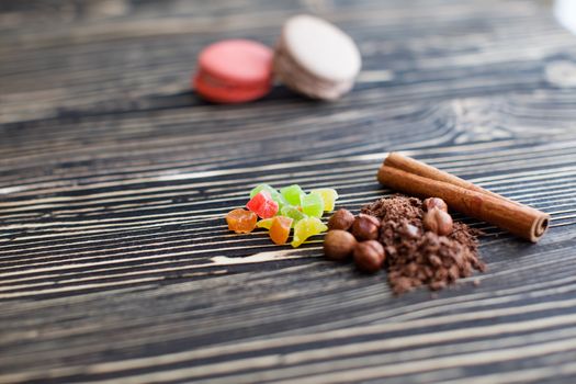 Nuts, cinnamon, candied fruits, chocolate chips lie on the texture table